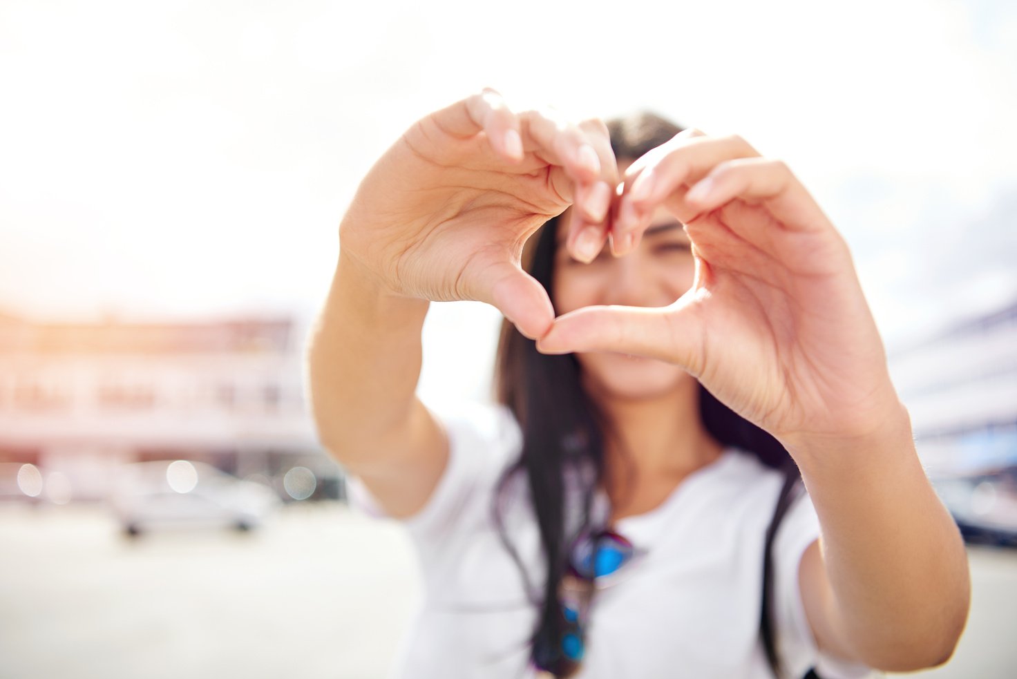  Young Woman Making a Heart Gesture